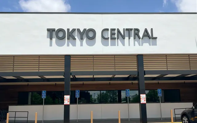 Tokyo Central storefront exterior with signage and parking area